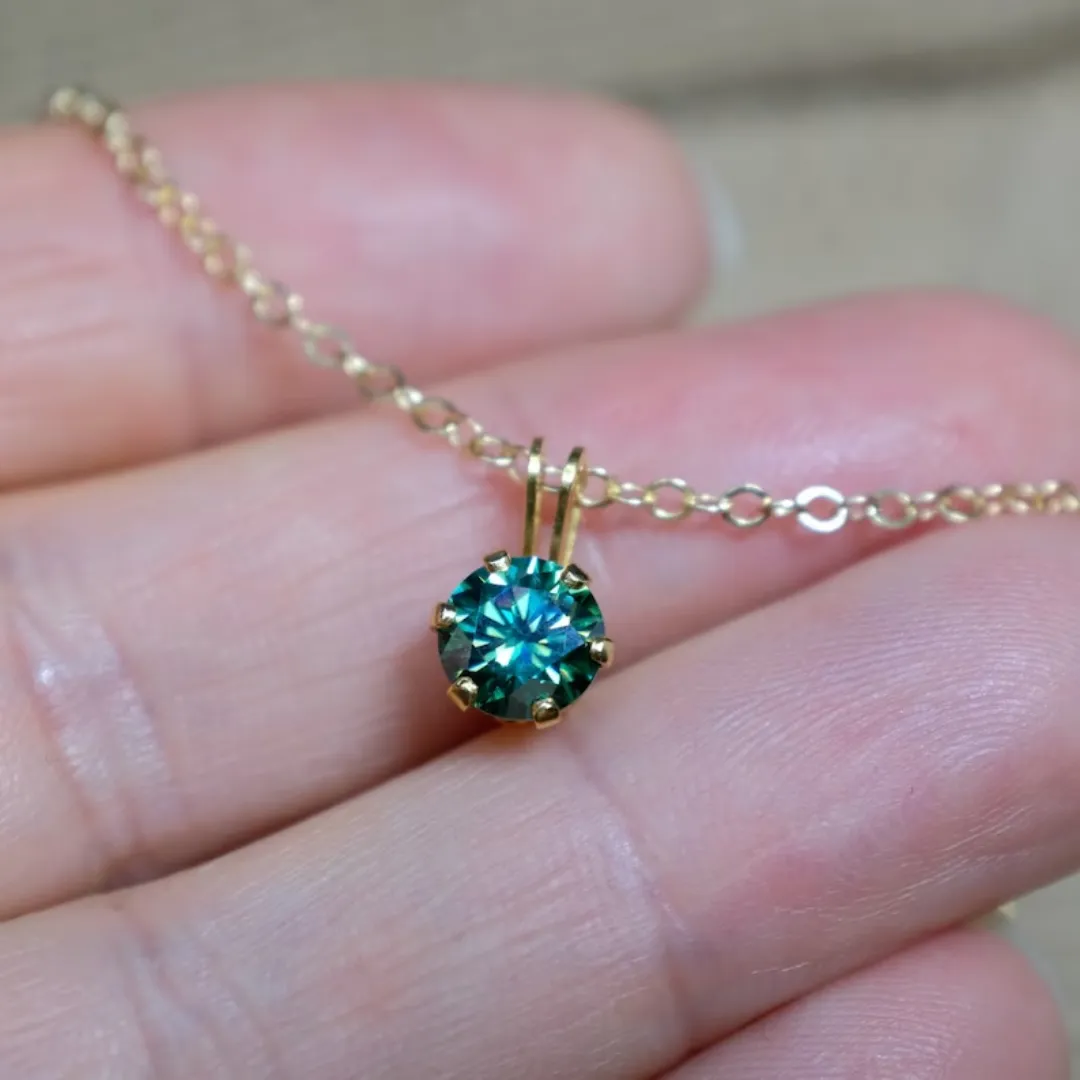 /public/photos/live/Delicate Round Cut Dark Green Moissanite Pendant   767 (1).webp